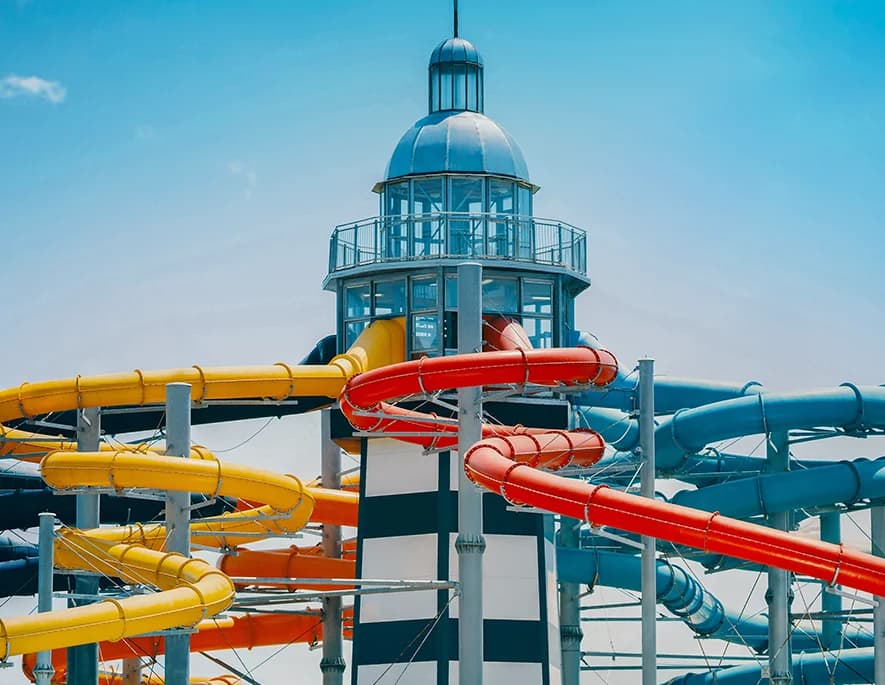 Gino’s lighthouse tower wrapped in twisting yellow, red and blue waterslides.